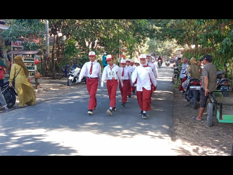 Semangat Kemerdekaan, Siswa-Siswi SDN 10 Curahtatal Ikuti Lomba Gerak Jalan